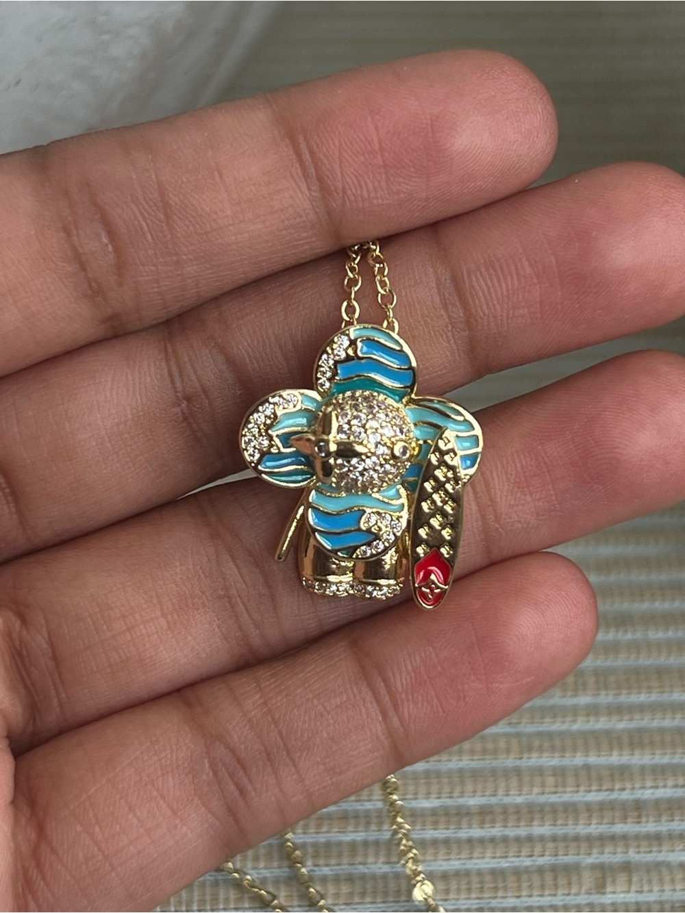 blue surfer floral gold pendant with pavé accents and detailed surfboard - Picture 5 of 5